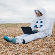 astronaut using a laptop